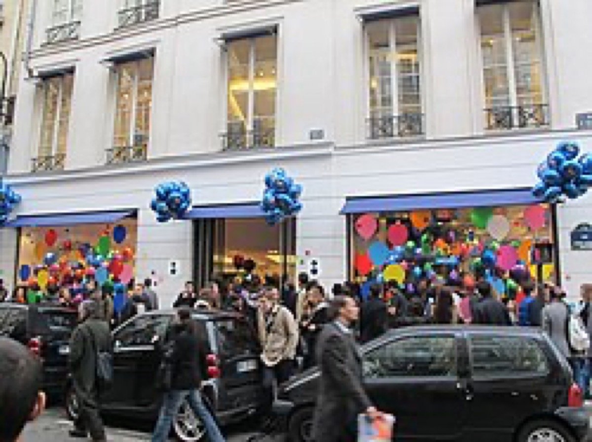 The façade of a curated concept store with a minimal storefront and window display.